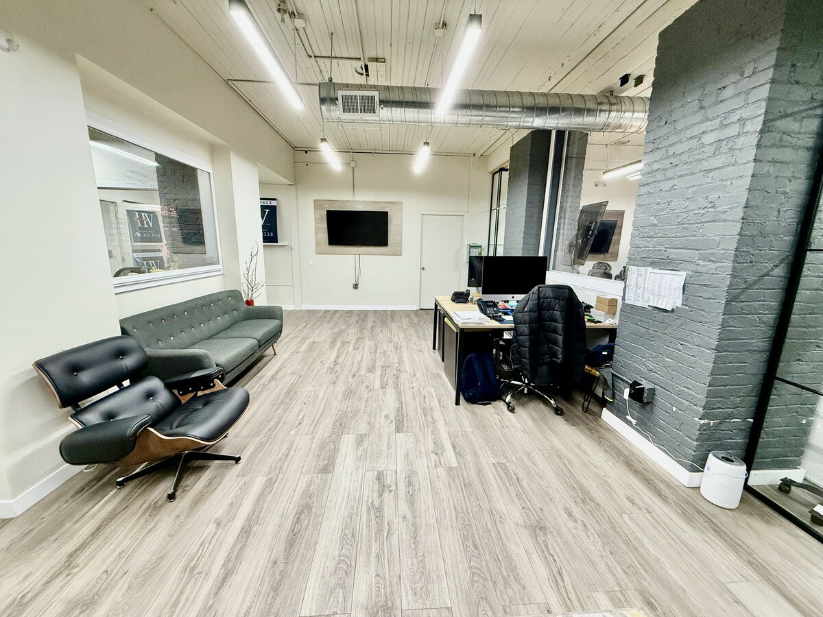 Main open workspace with brick feature wall