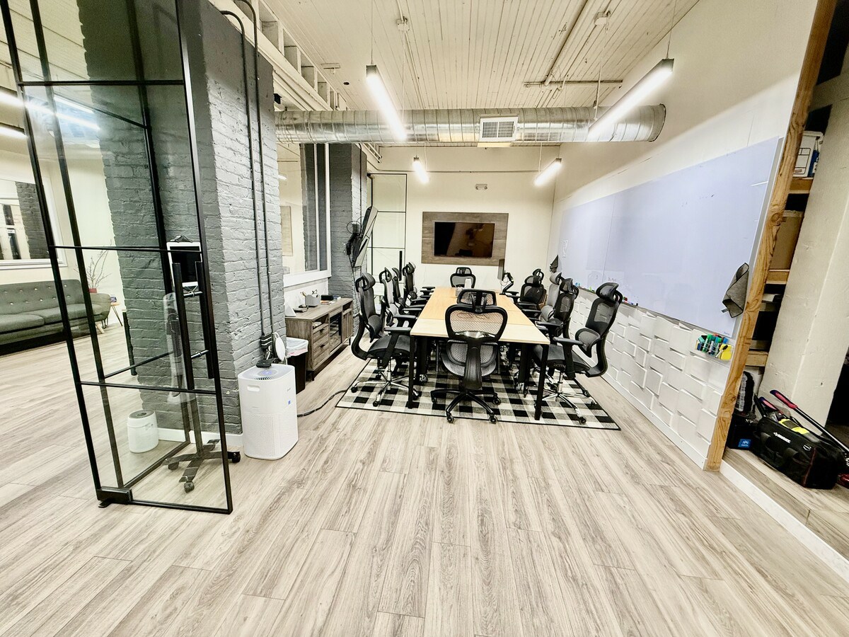 Large conference room with whiteboard wall