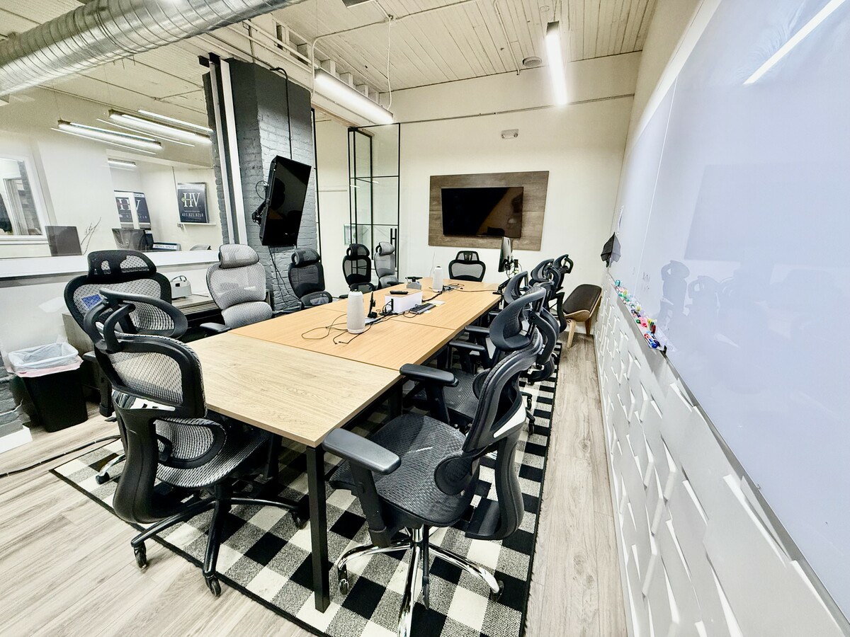Conference room with full whiteboard and TV